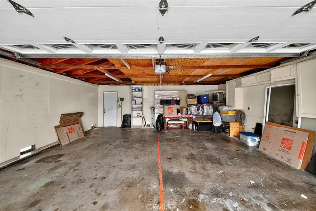 an aerial view of residential house with outdoor space and swimming pool