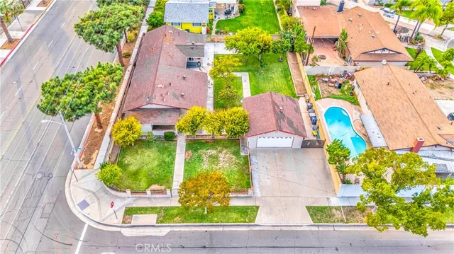 an aerial view of residential houses with outdoor space