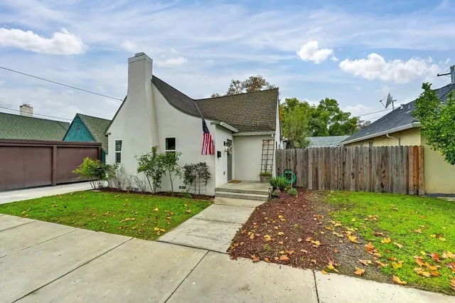 a view of a livingroom with a fireplace and window