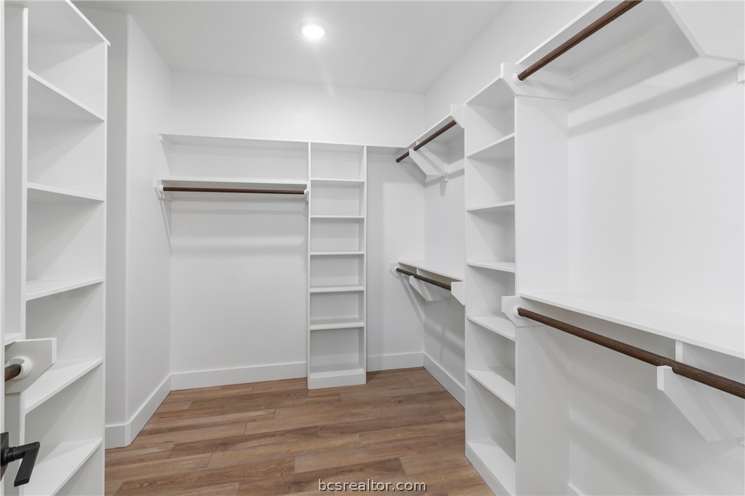 7822 Mathis Crk Drive Bryan, TX 77808 - Photo 23 of 43 a view of walk in closet with empty racks