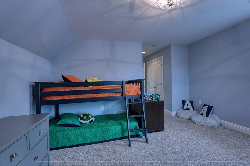 230 Beacom Drive Beaver, PA 15009 - Photo 18 of 25 a room that has a bed and a dresser in it