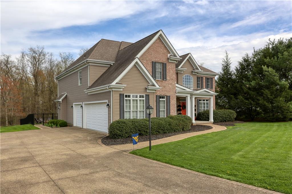 230 Beacom Drive Beaver, PA 15009 - Photo 2 of 25 a front view of a house with a yard and garage