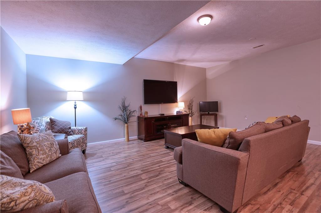 230 Beacom Drive Beaver, PA 15009 - Photo 22 of 25 a living room with furniture and a flat screen tv