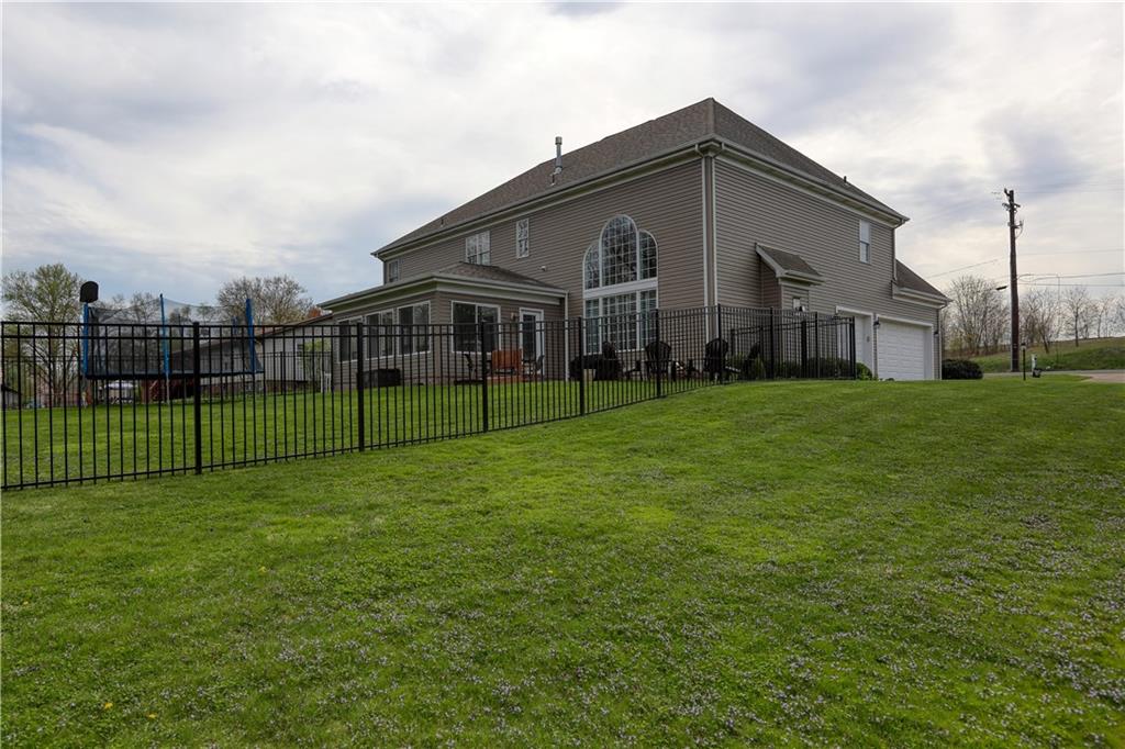 230 Beacom Drive Beaver, PA 15009 - Photo 24 of 25 a view of a house with a yard and a garden