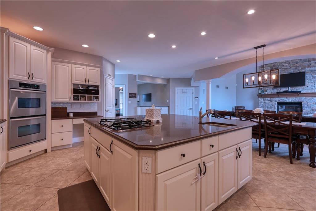 230 Beacom Drive Beaver, PA 15009 - Photo 7 of 25 a kitchen with stainless steel appliances granite countertop a stove and a sink