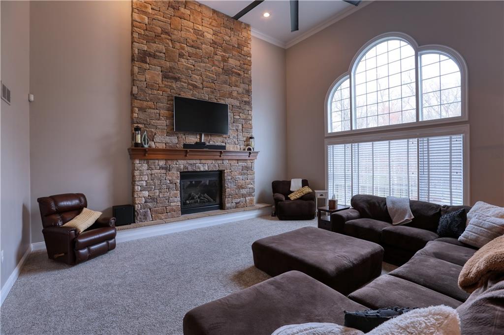 230 Beacom Drive Beaver, PA 15009 - Photo 9 of 25 a living room with furniture a fireplace and a flat screen tv