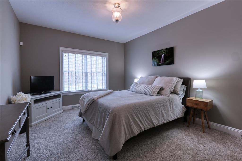 230 Beacom Drive Beaver, PA 15009 - Photo 10 of 25 a spacious bedroom with a bed and a flat screen tv