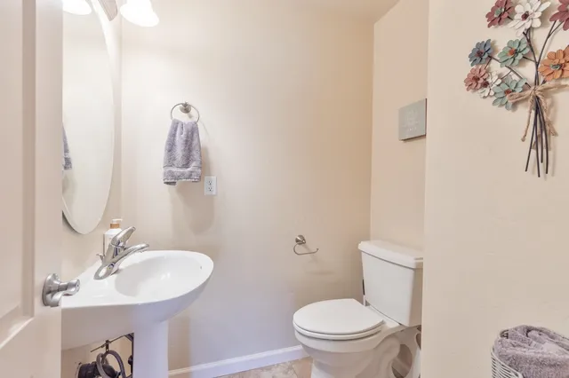 a spacious bedroom with a bed and glass window