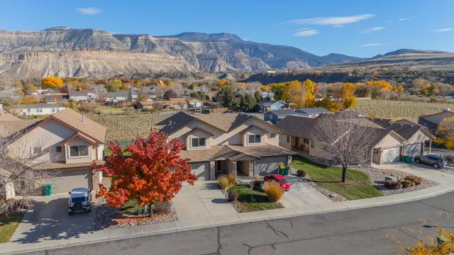 an aerial view of residential houses with outdoor space