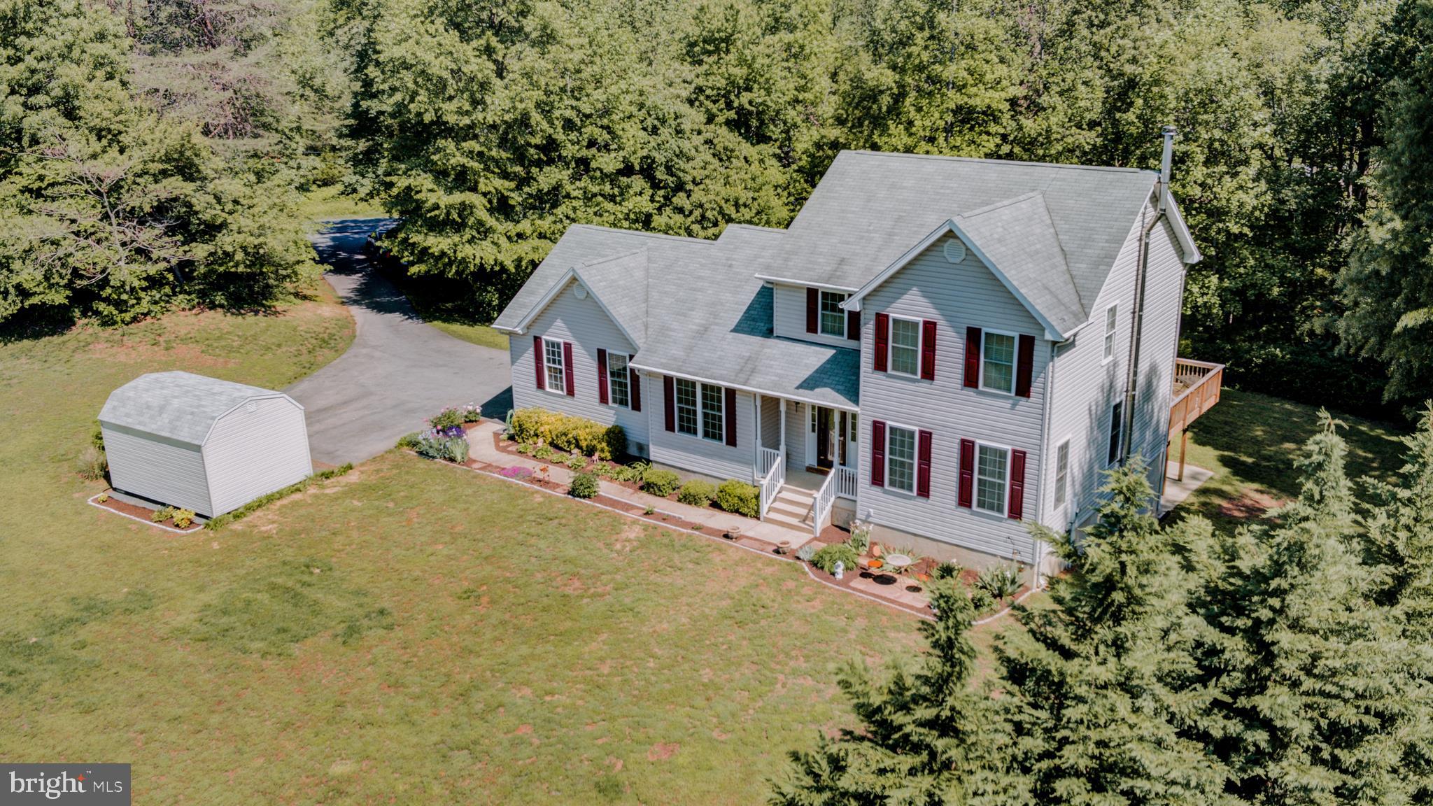 Located on Private 2.63 Acre Lot backing to trees