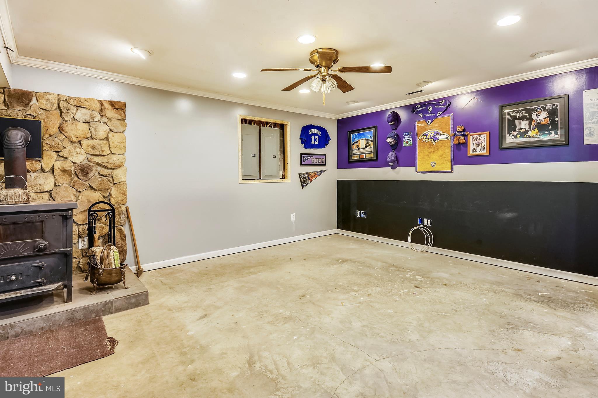 5300 Sheridan Point Road Prince Frederick, MD 20678 - Photo 16 of 50 Lower Level Game/Rec Room w/Wood Stove