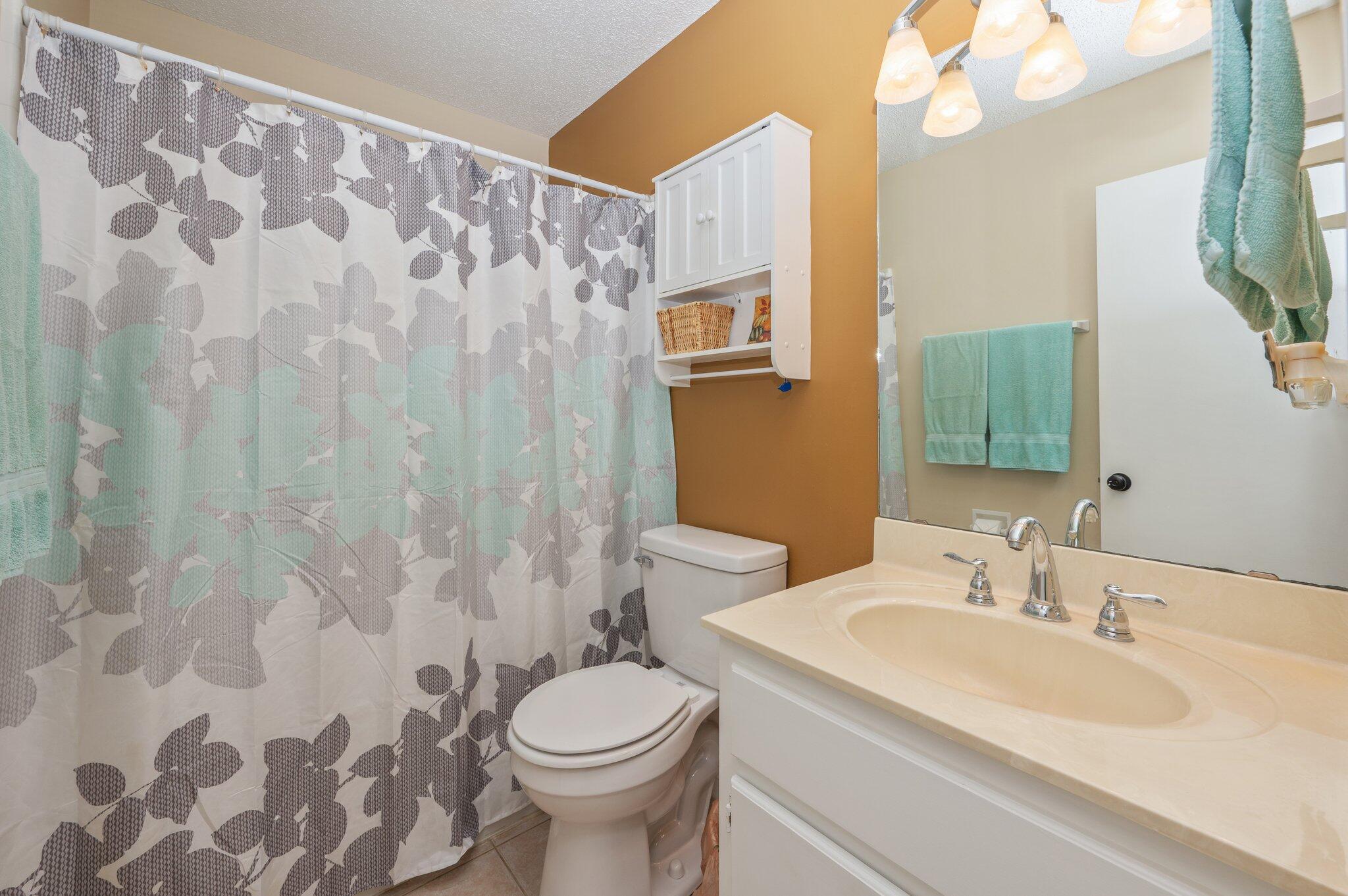 6256 Misty Lane Crestview, FL 32539 - Photo 21 of 39 a bathroom with a sink and a mirror