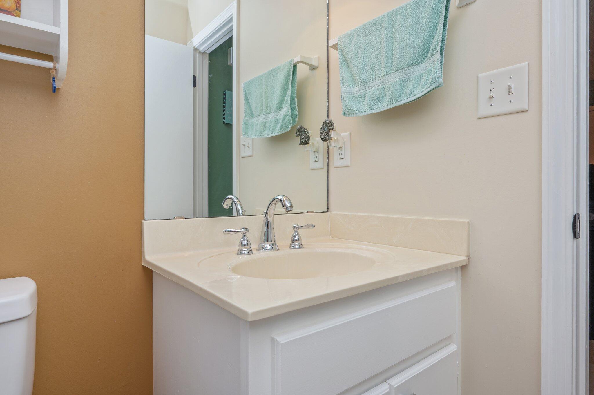 6256 Misty Lane Crestview, FL 32539 - Photo 23 of 39 a bathroom with a sink and a mirror