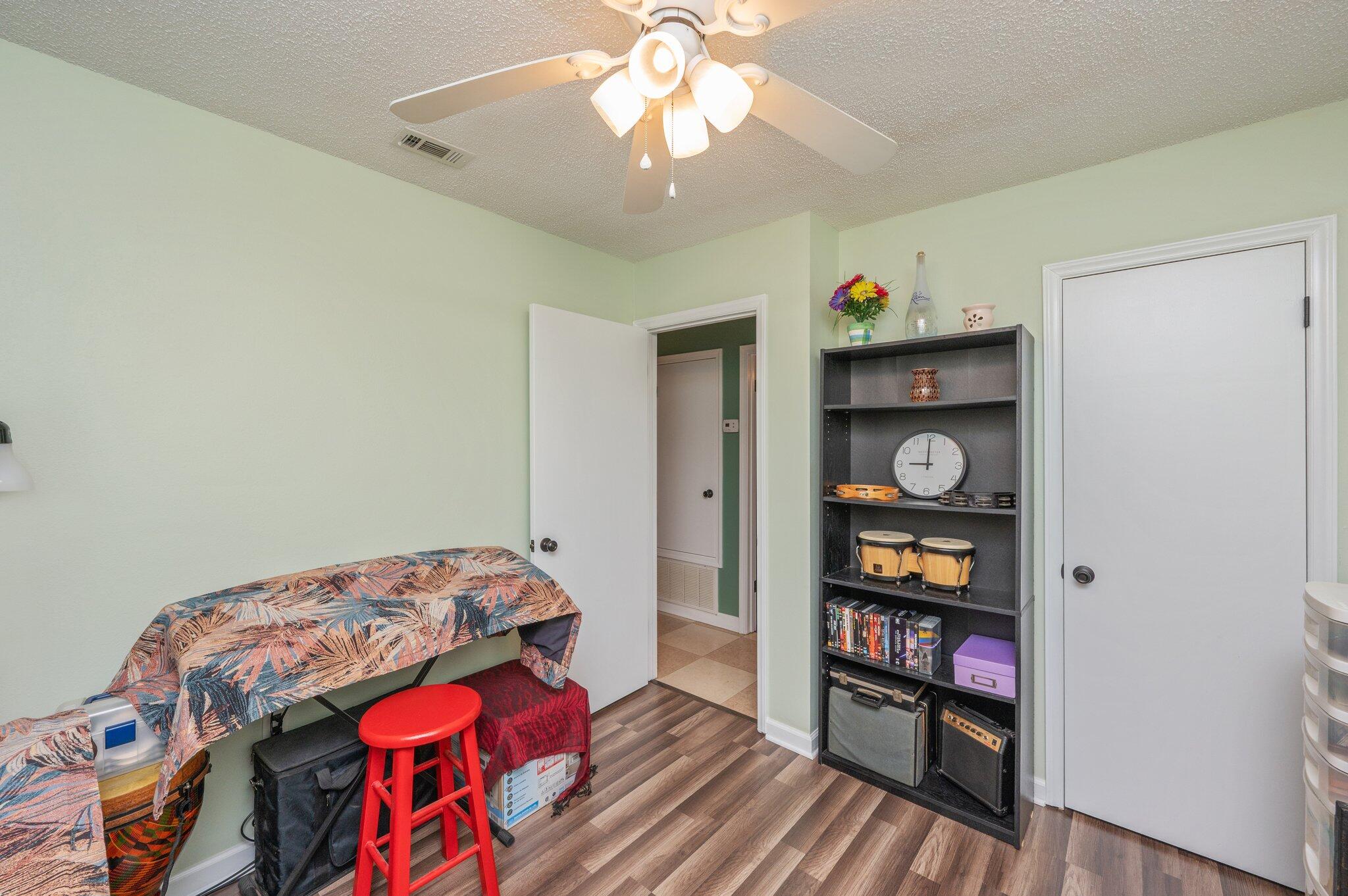 6256 Misty Lane Crestview, FL 32539 - Photo 25 of 39 a bedroom with a bed and a bookshelf