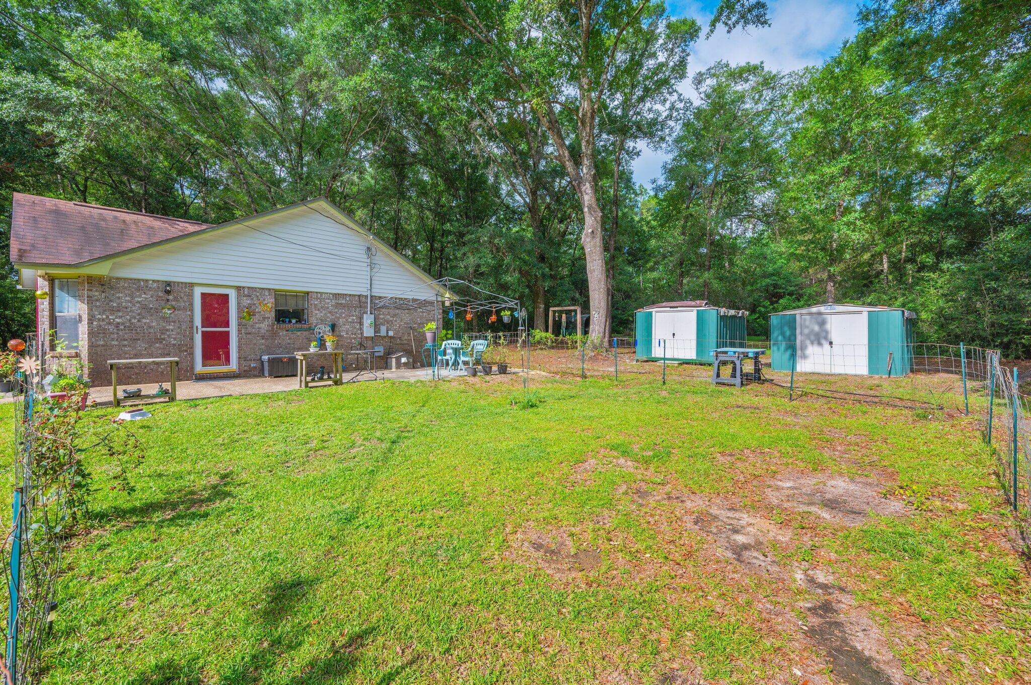 6256 Misty Lane Crestview, FL 32539 - Photo 27 of 39 a front view of house with yard and green space