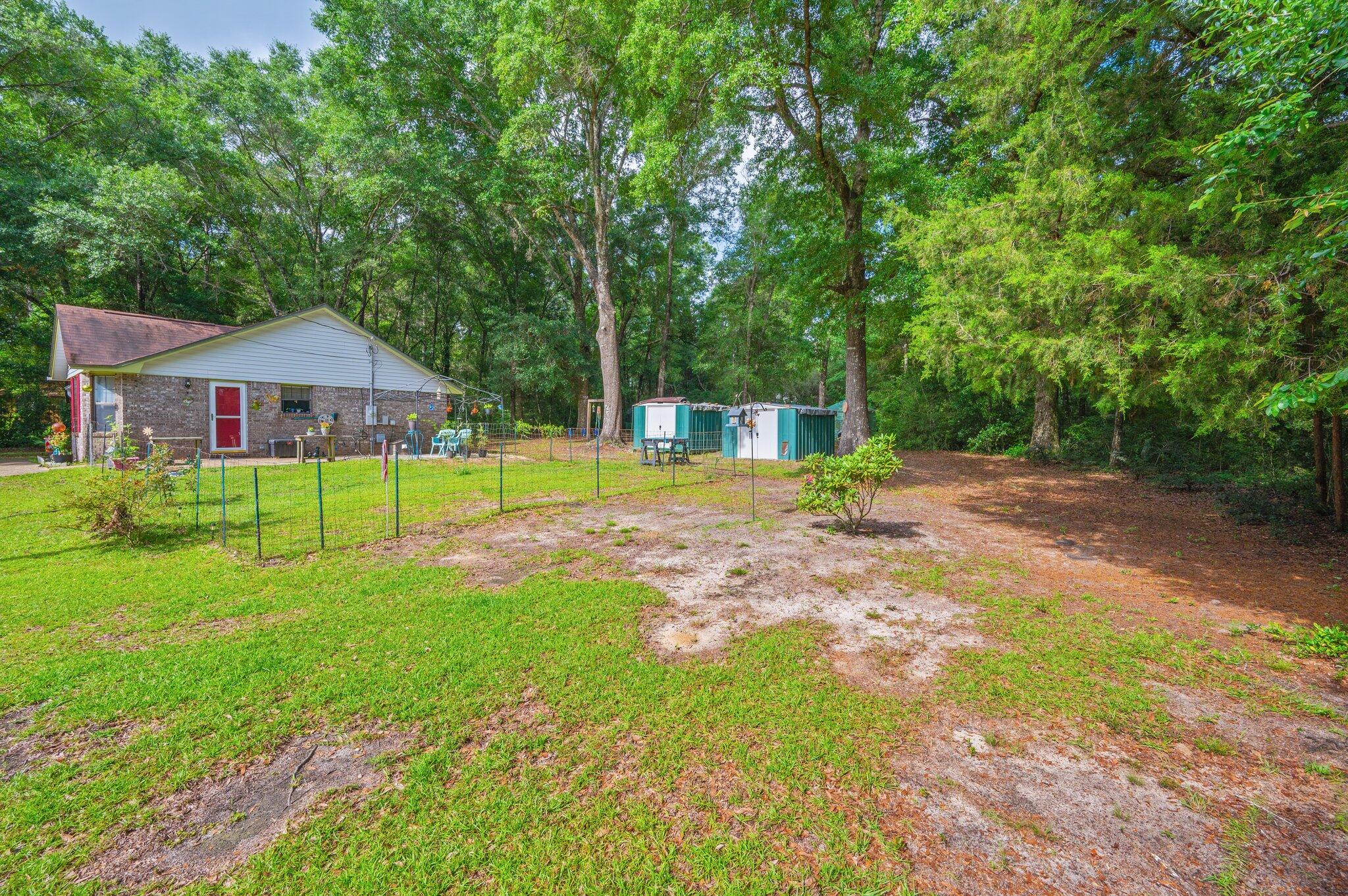6256 Misty Lane Crestview, FL 32539 - Photo 28 of 39 a view of a back yard with a patio
