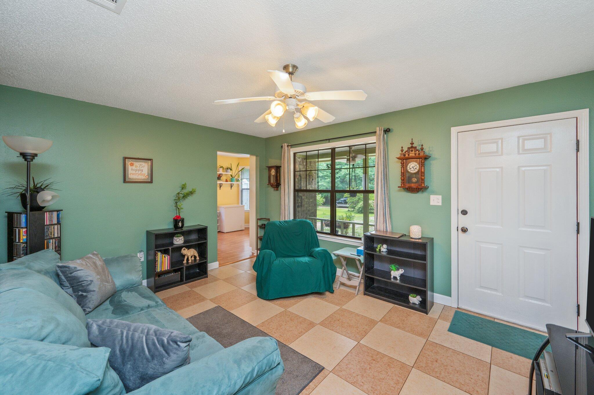 6256 Misty Lane Crestview, FL 32539 - Photo 7 of 39 a living room with furniture and a window