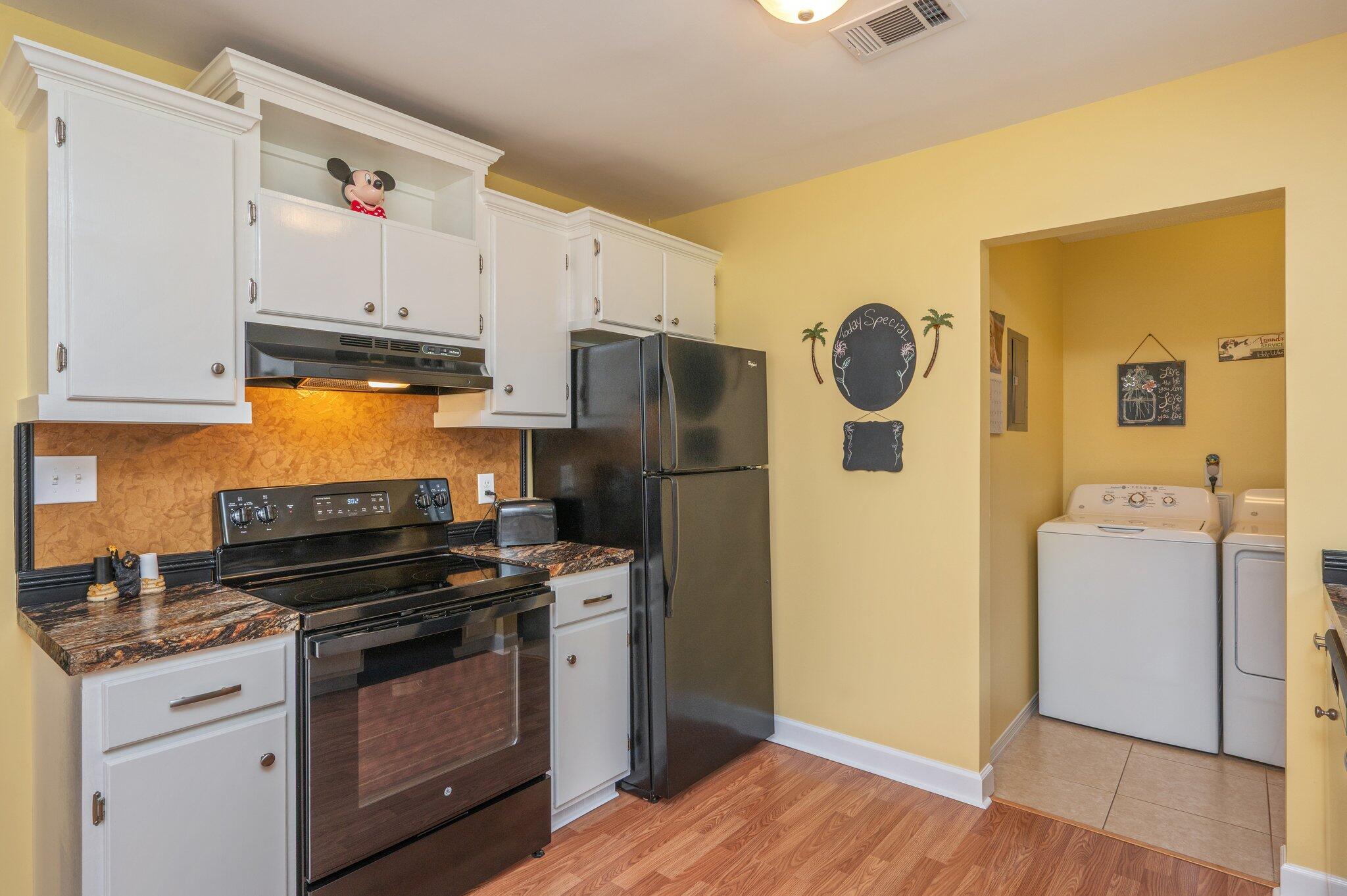 6256 Misty Lane Crestview, FL 32539 - Photo 10 of 39 a kitchen with a refrigerator and a stove top oven