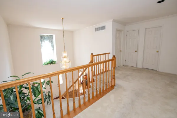 a view of a hallway with windows