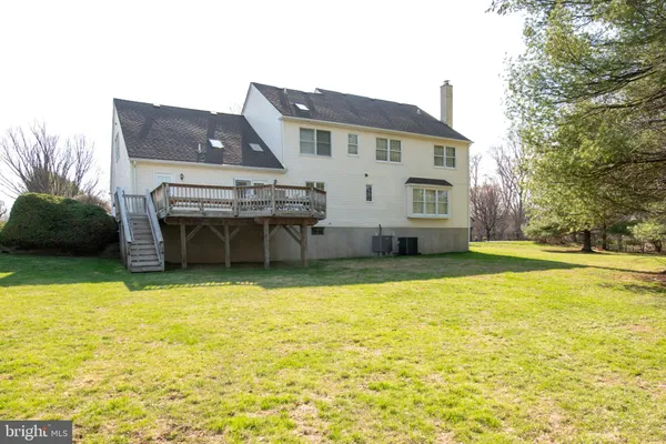 a view of yard with swimming pool and trees