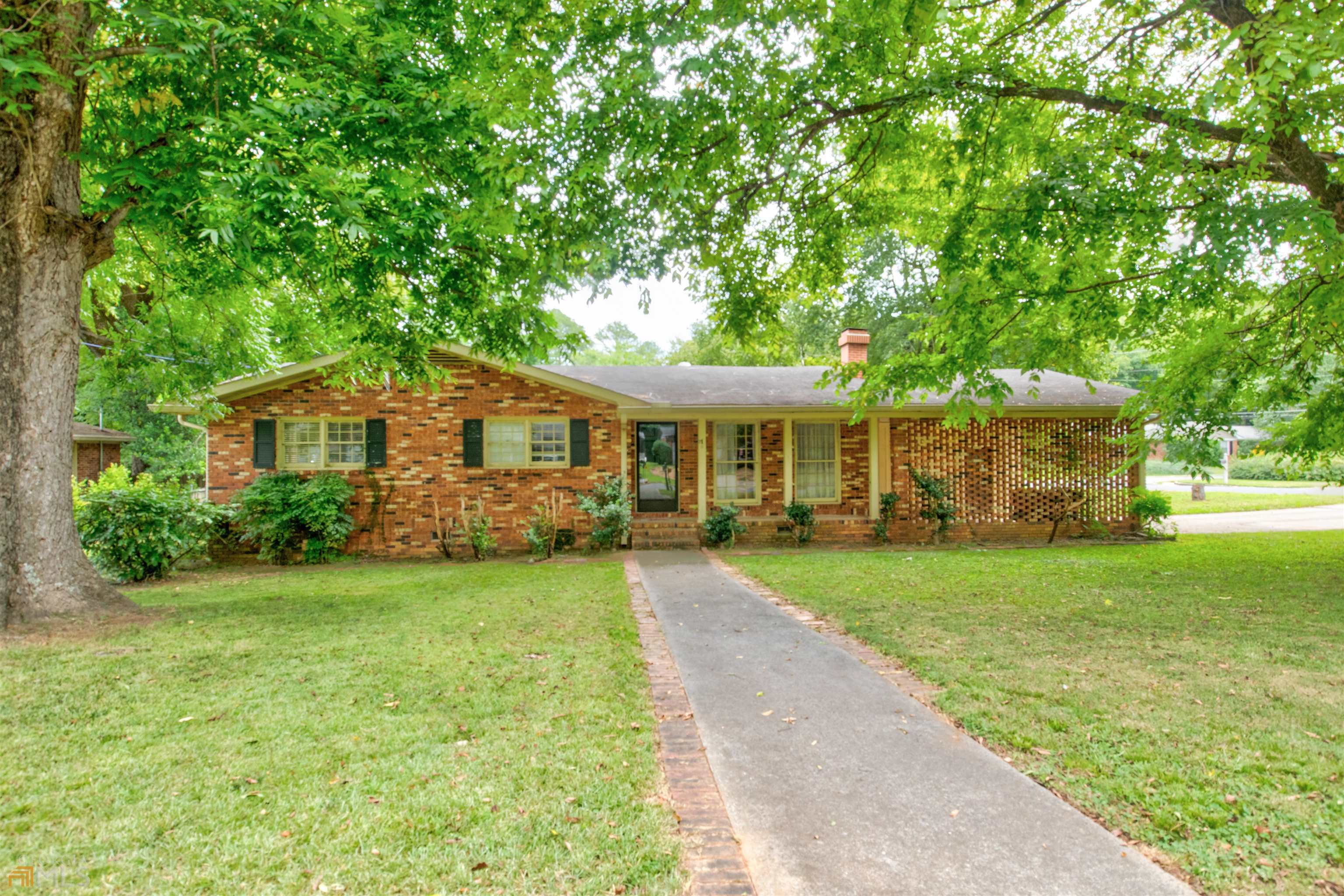109 Parkway Drive Rome, GA 30161 - Photo 1 of 1 a front view of a house with garden