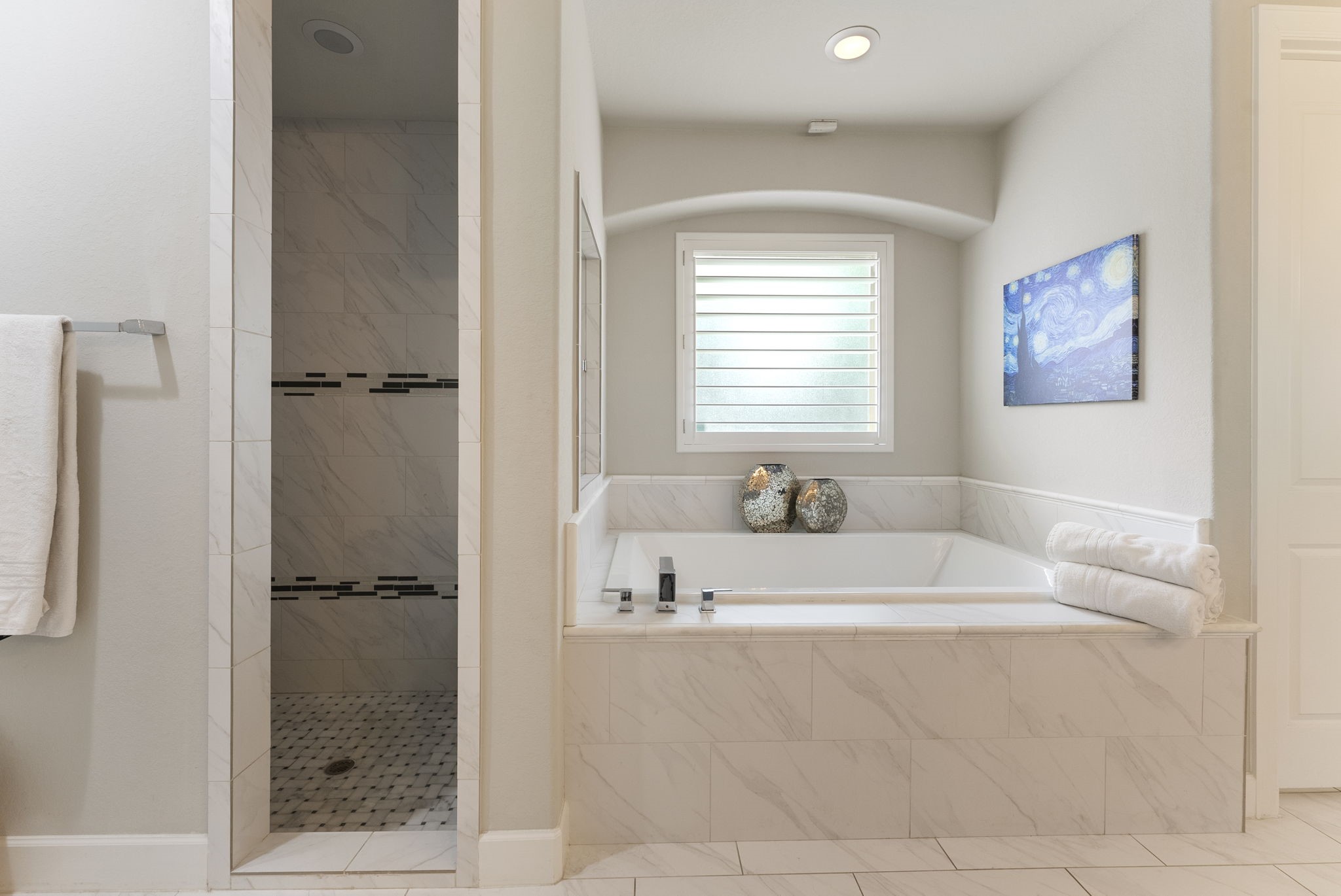25607 Muirfield Bend Court Spring, TX 77389 - Photo 18 of 30 Tranquil primary retreat highlighted by a relaxing soaking tub, oversized shower, and elegant tilework that blends comfort with modern luxury.