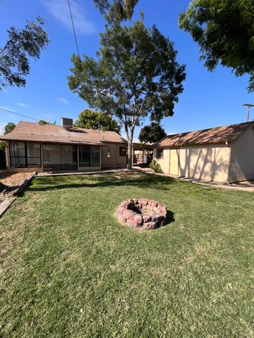 a view of a roof deck with wooden fence