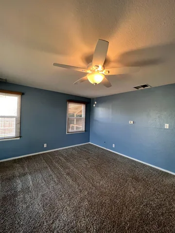 an empty room with a empty space and a window