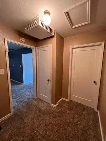 a view of empty room with windows