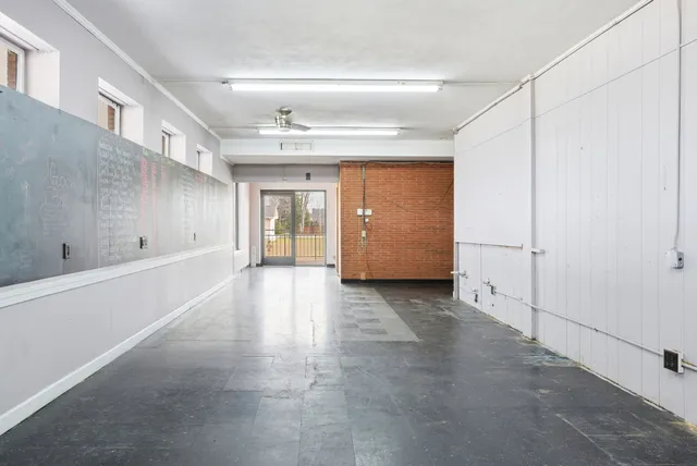 a view of a hallway with an empty room