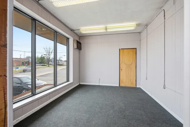 a view of an empty room and window
