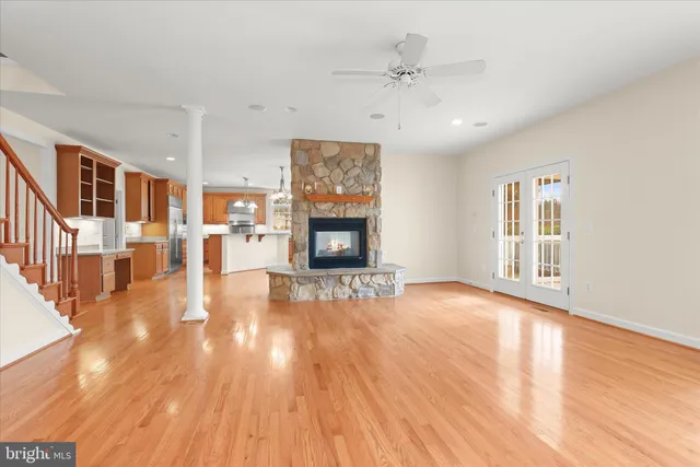 a bathroom with a sink toilet a mirror and shower