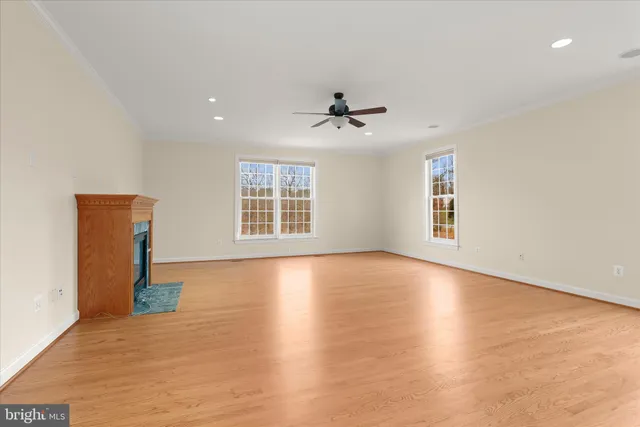 a spacious bathroom with a tub a sink and mirror