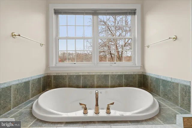 a view of a house with backyard sitting area and garden