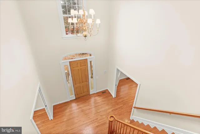 an aerial view of a house with garden space and street view