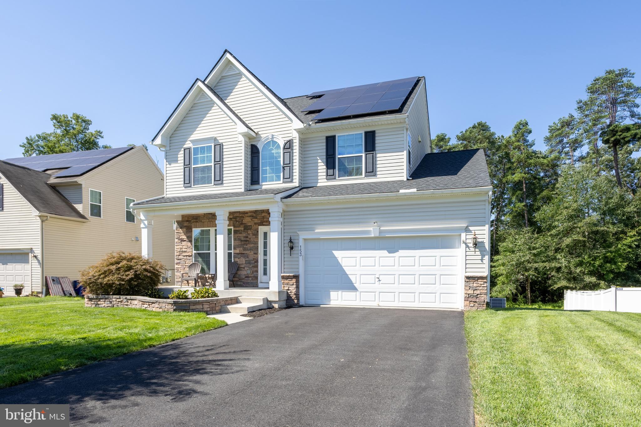 153 Cool Springs Road North East, MD 21901 - Photo 1 of 47 a front view of a house with a yard and garage