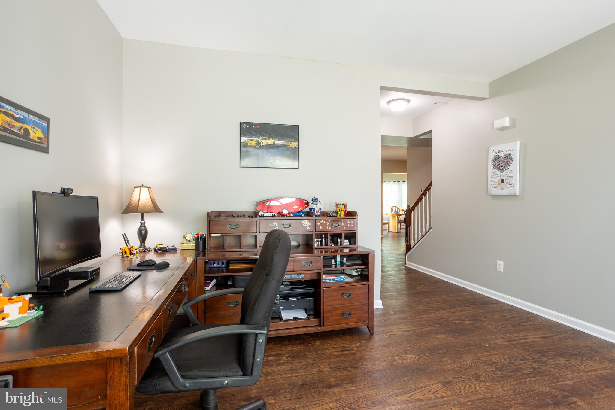 153 Cool Springs Road North East, MD 21901 - Photo 18 of 47 a view of a workspace with furniture and a flat screen tv