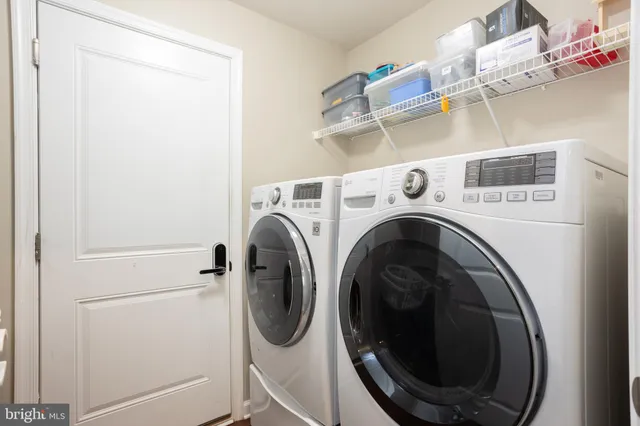 a utility room with dryer and washer