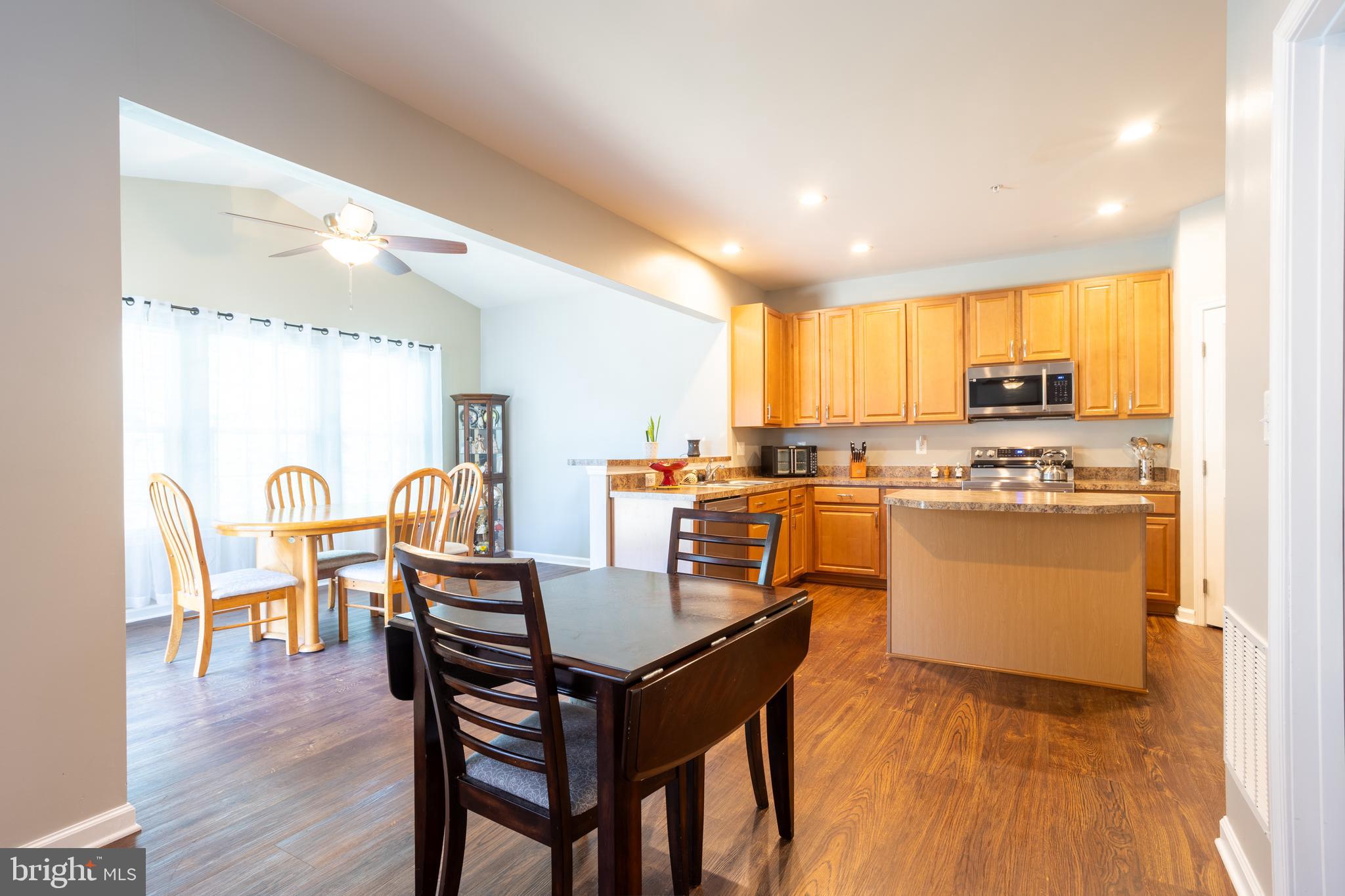 153 Cool Springs Road North East, MD 21901 - Photo 20 of 47 a kitchen with a table chairs microwave and cabinets