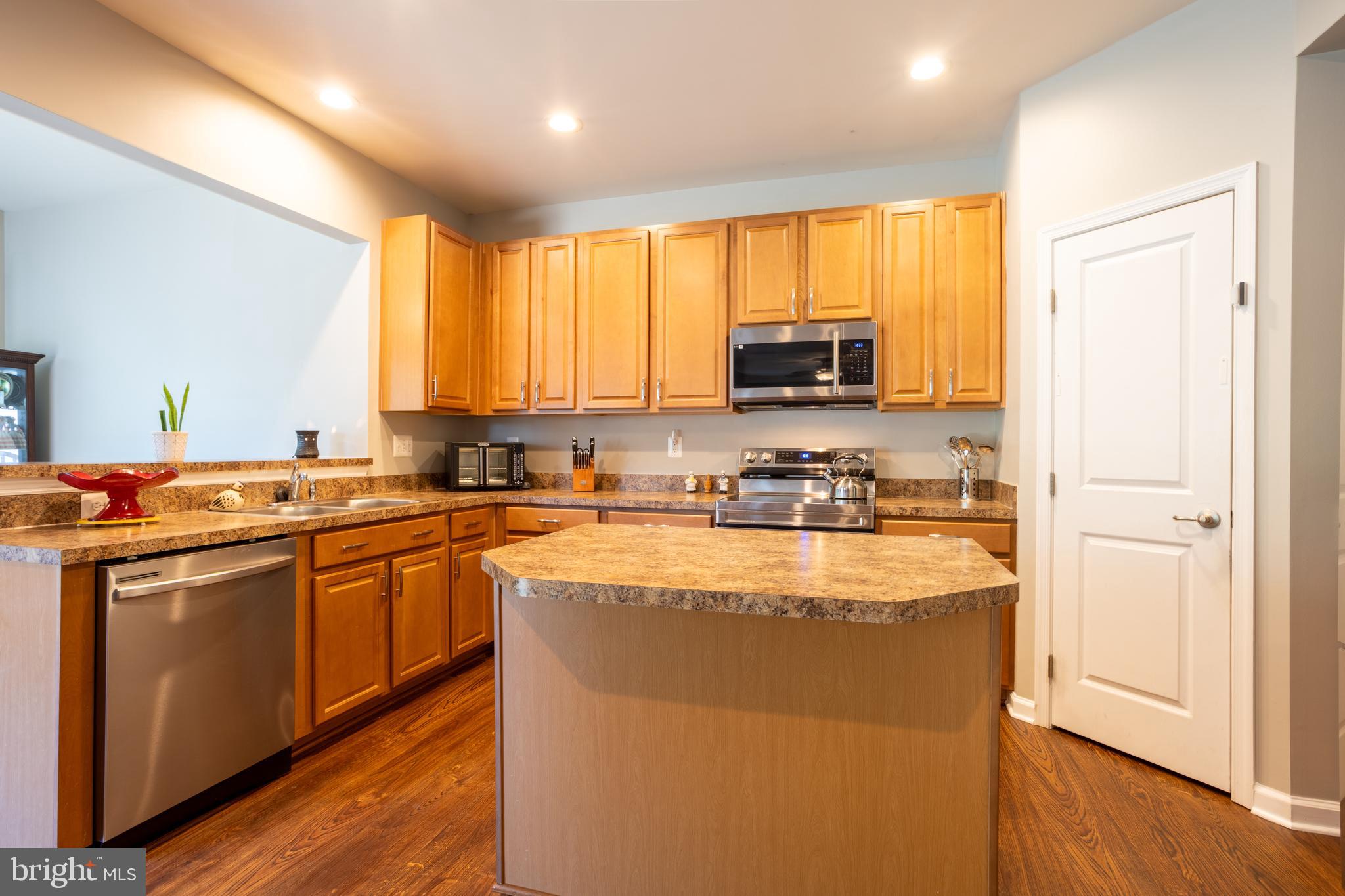 153 Cool Springs Road North East, MD 21901 - Photo 22 of 47 a kitchen with stainless steel appliances granite countertop a stove a sink a refrigerator and a microwave