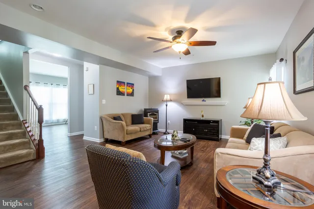 a living room with furniture fireplace and a flat screen tv