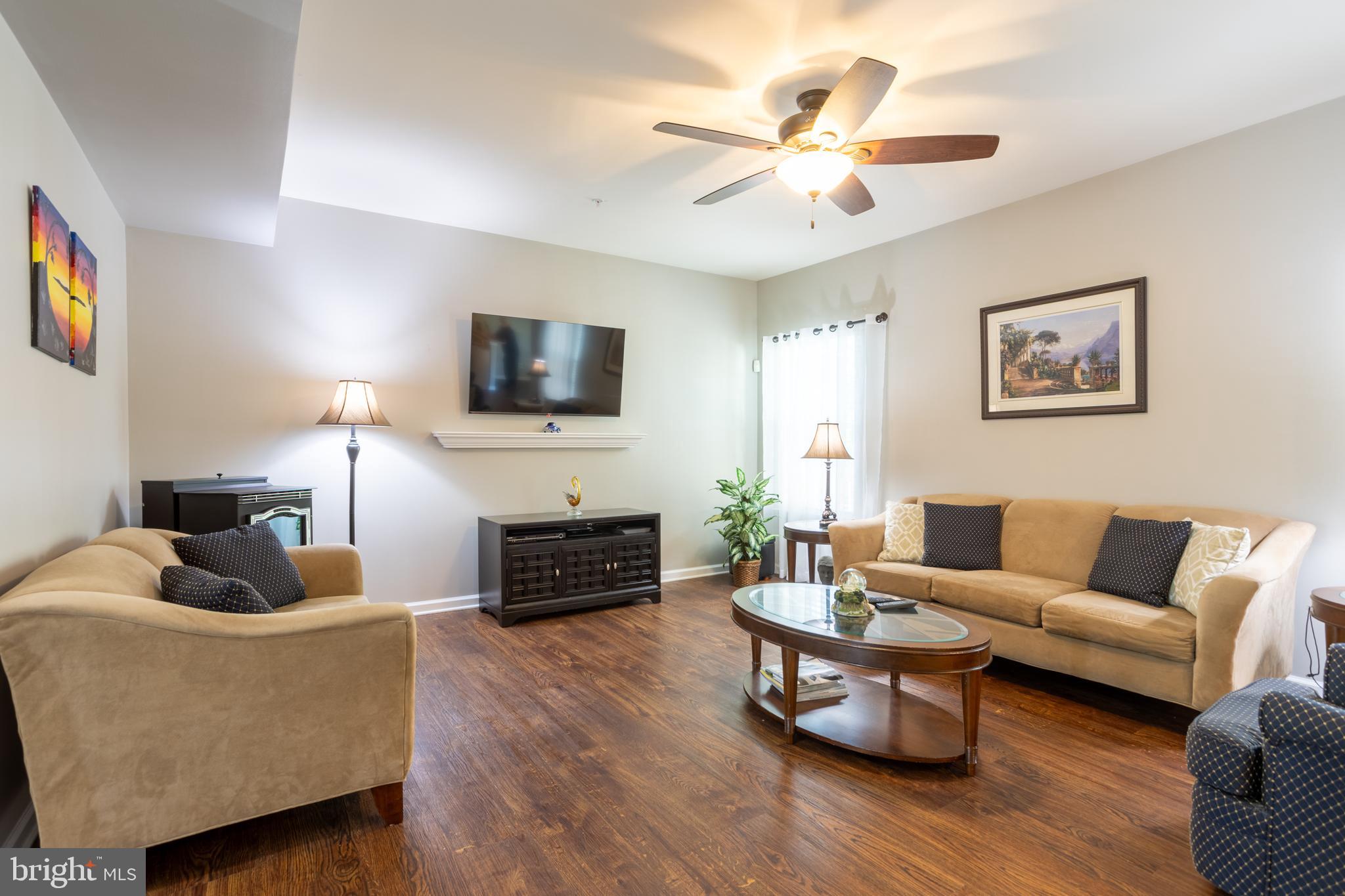 153 Cool Springs Road North East, MD 21901 - Photo 27 of 47 a living room with furniture a flat screen tv and a fireplace