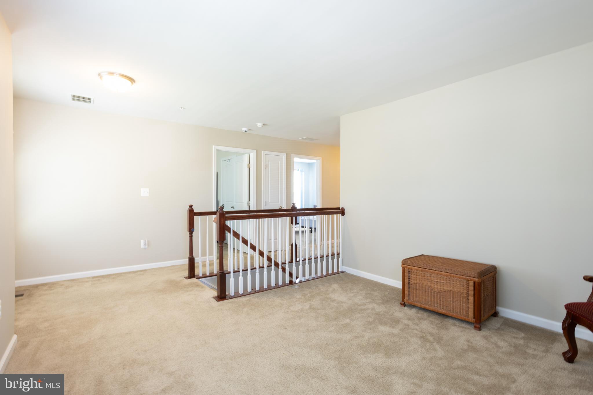 153 Cool Springs Road North East, MD 21901 - Photo 34 of 47 a view of staircase with railing and white walls