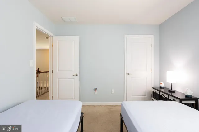 a bedroom with a bed and a cabinets