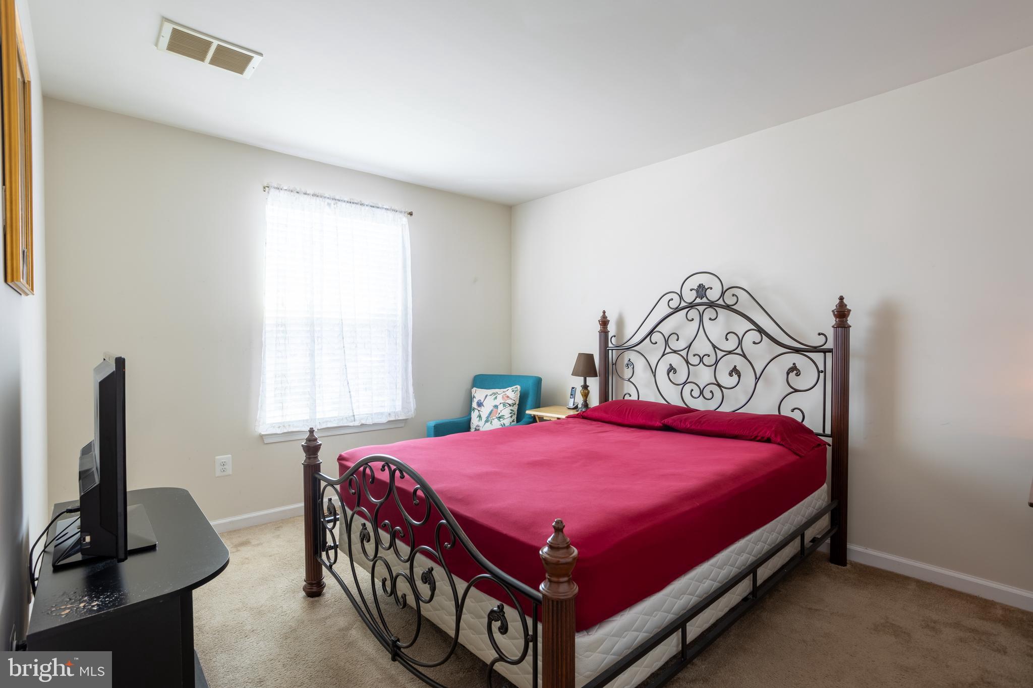 153 Cool Springs Road North East, MD 21901 - Photo 39 of 47 a bed room with a bed and a tv