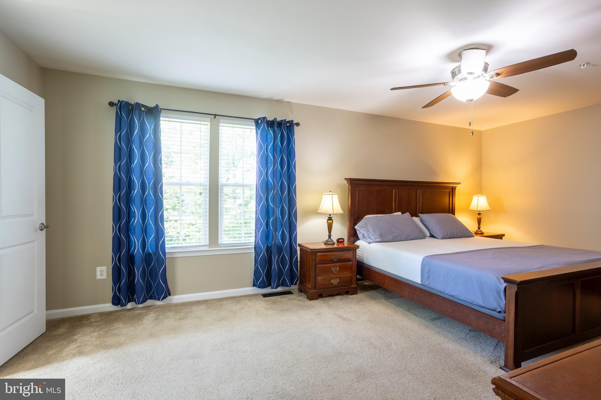 153 Cool Springs Road North East, MD 21901 - Photo 44 of 47 a bedroom with a bed and a chandelier