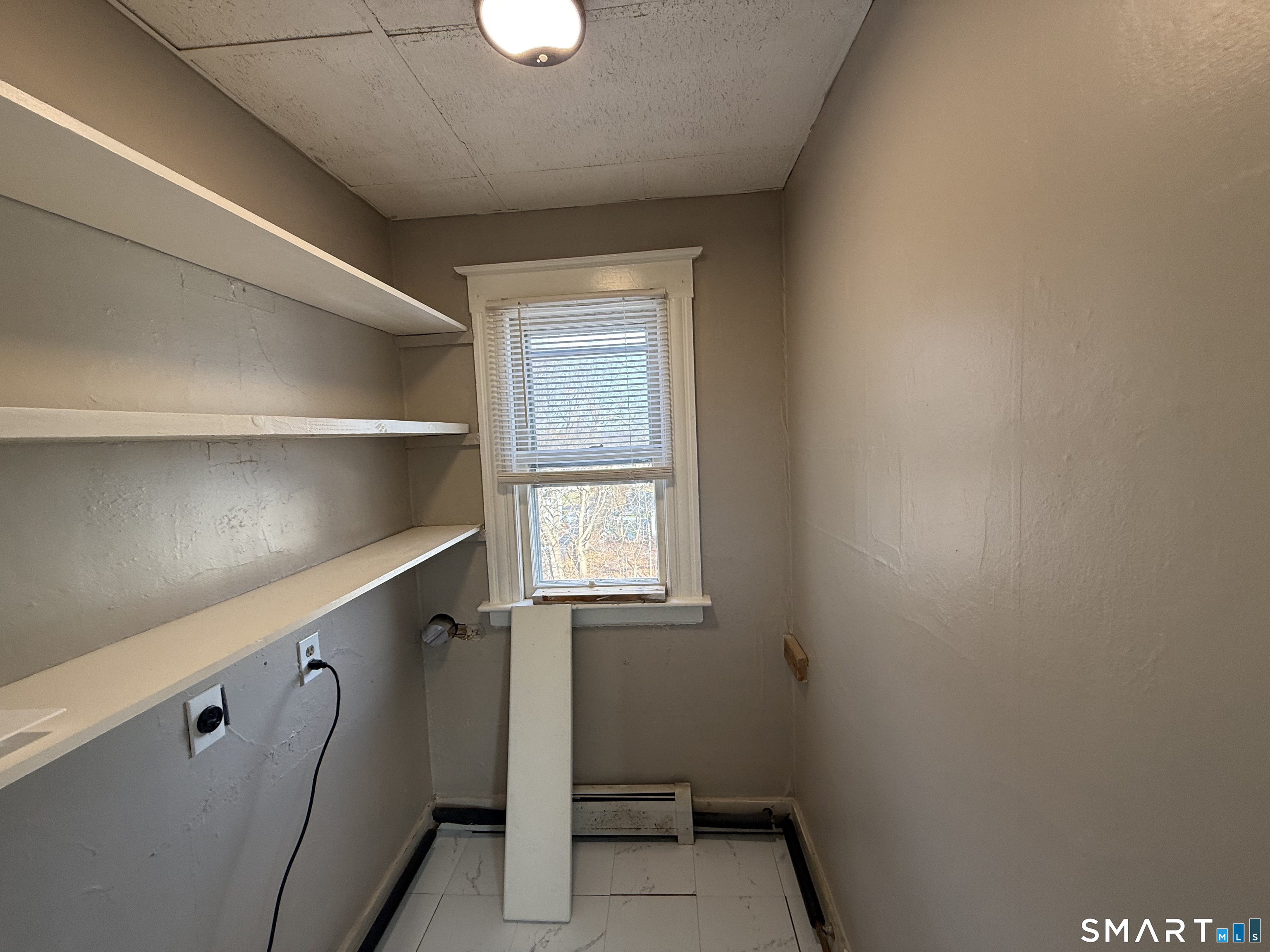 154 Daly Avenue, Unit 3 New Britain, CT 06051 - Photo 14 of 25 a view of an empty room with a window