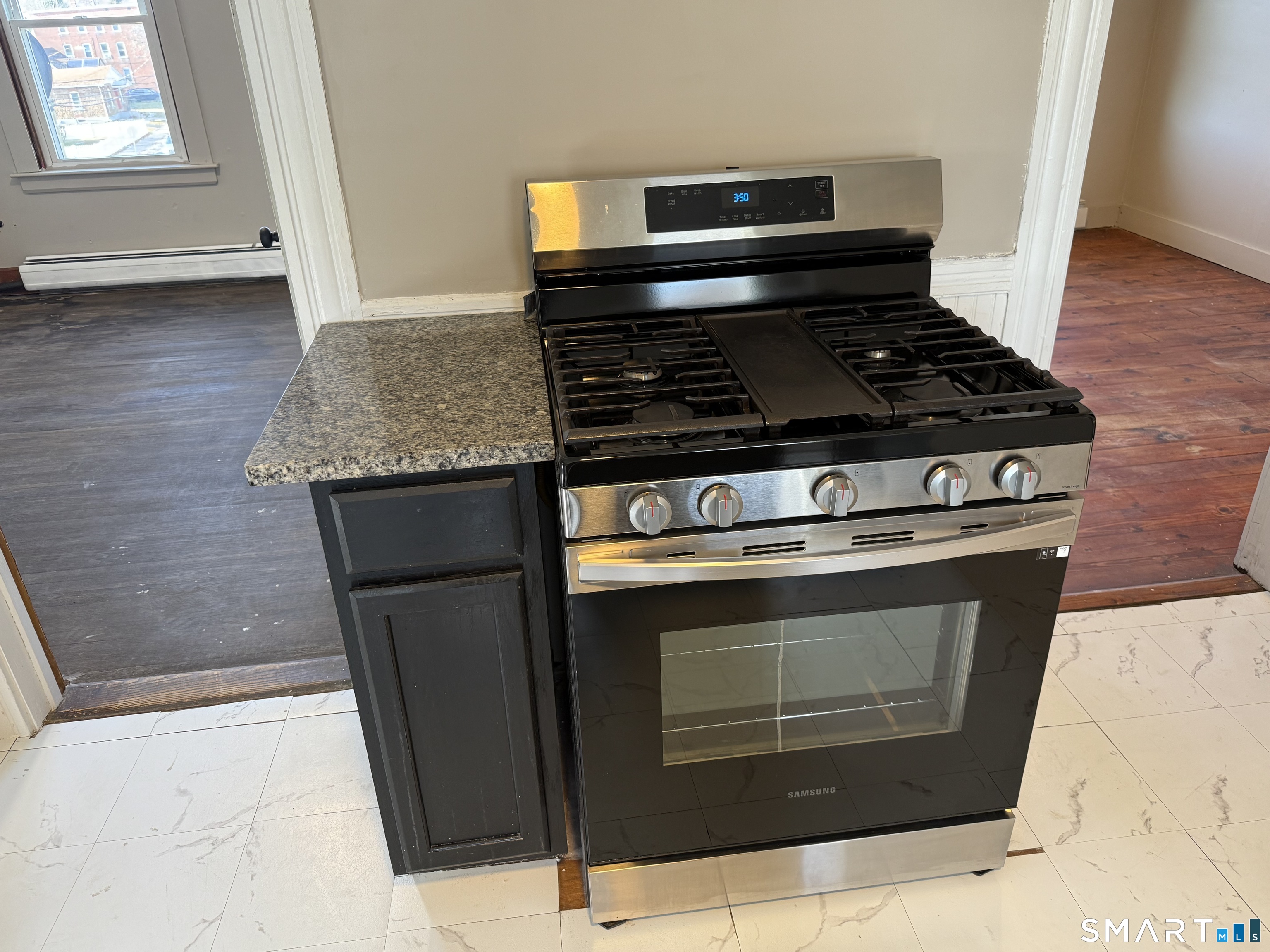 154 Daly Avenue, Unit 3 New Britain, CT 06051 - Photo 16 of 25 a stove top oven sitting inside of a kitchen