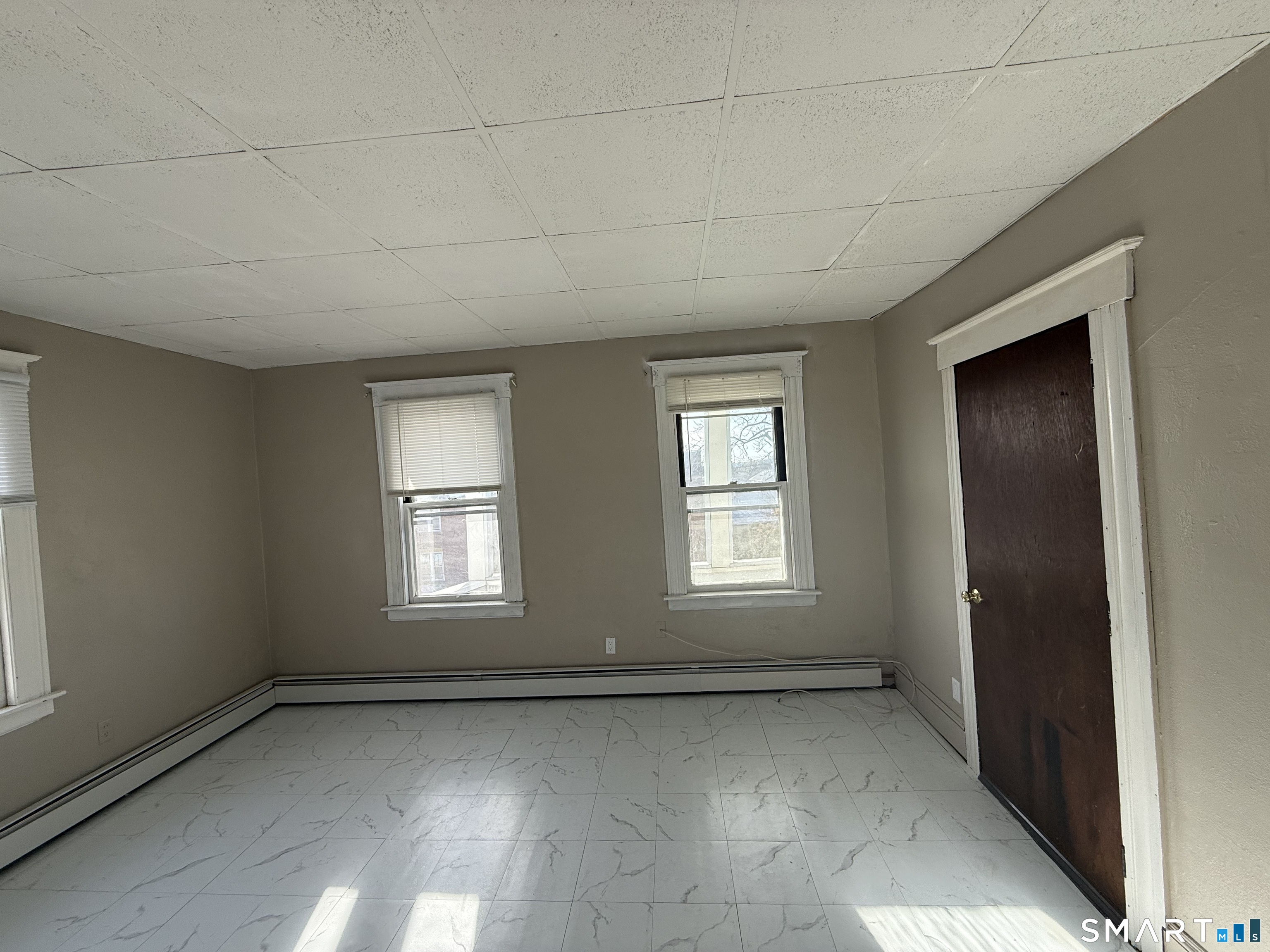 154 Daly Avenue, Unit 3 New Britain, CT 06051 - Photo 23 of 25 an empty room with a window