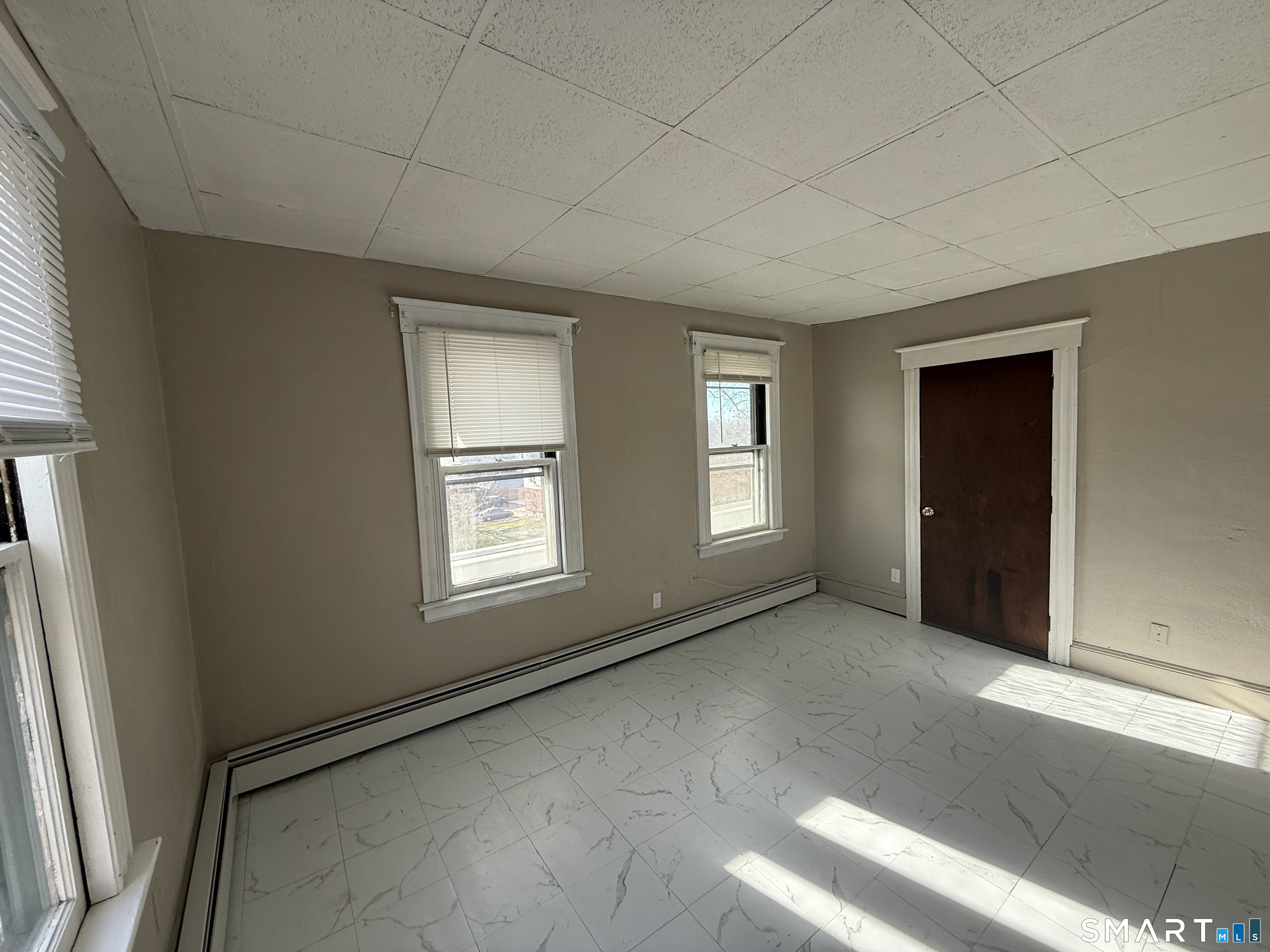 154 Daly Avenue, Unit 3 New Britain, CT 06051 - Photo 25 of 25 an empty room with windows